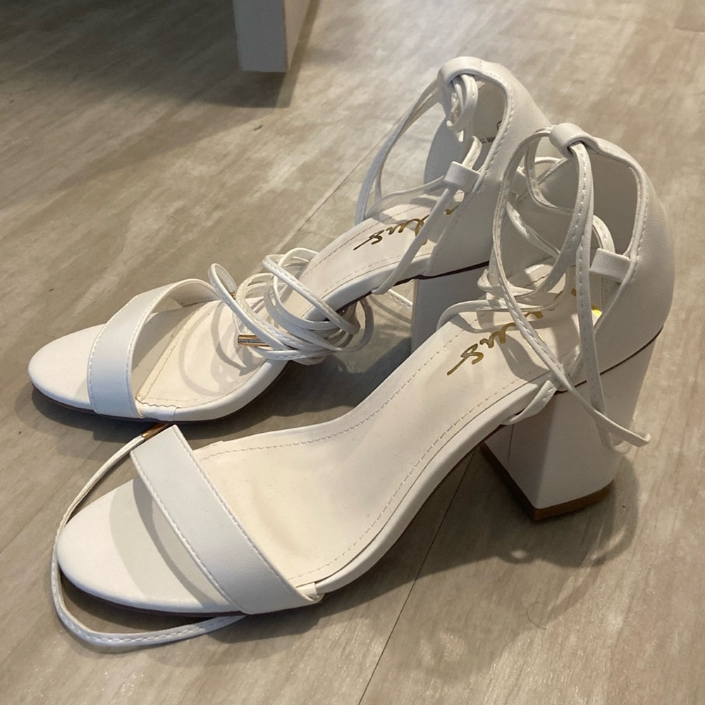 Lulu’s white heels